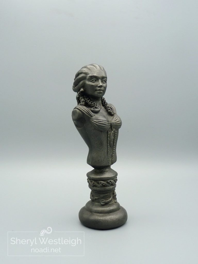 Cold Cast Steel bust of a woman with pale skin and blue tentacles instead of heair.